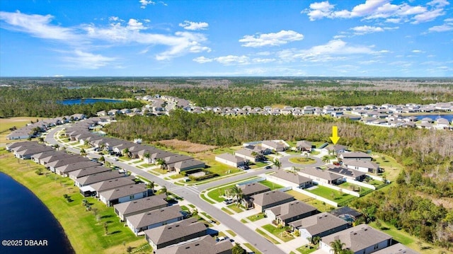 birds eye view of property featuring a residential view and a water view