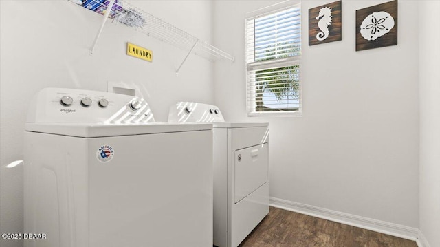 laundry area featuring laundry area, baseboards, independent washer and dryer, and dark wood-style flooring