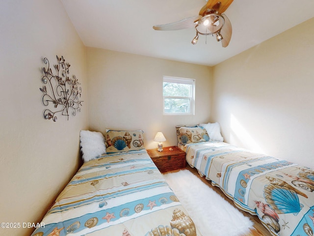 823 E 10th Ave, New Smyrna Beach, FL 32169 - bedroom featuring a ceiling fan and wood finished floors