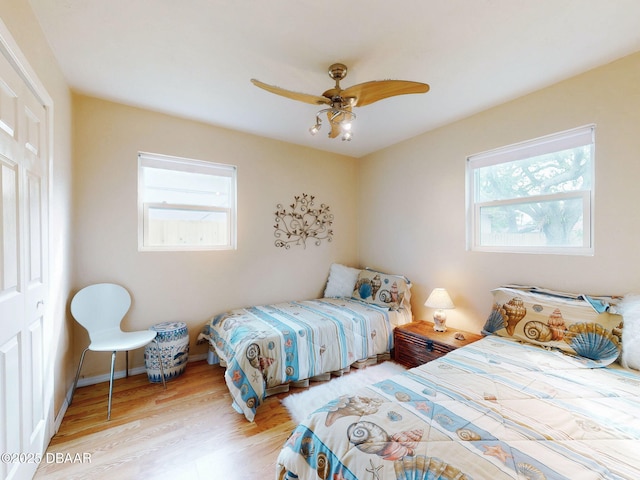 823 E 10th Ave, New Smyrna Beach, FL 32169 - bedroom featuring wood finished floors and ceiling fan