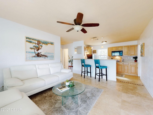 823 E 10th Ave, New Smyrna Beach, FL 32169 - living area featuring a ceiling fan and light tile patterned floors