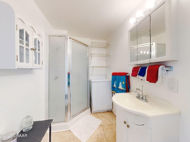 823 E 10th Ave, New Smyrna Beach, FL 32169 - full bath featuring a shower stall, vanity, and tile patterned floors