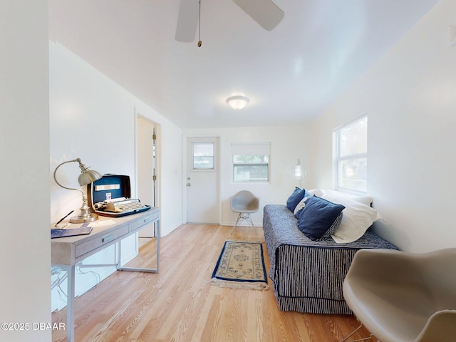 823 E 10th Ave, New Smyrna Beach, FL 32169 - living room featuring wood finished floors and a ceiling fan