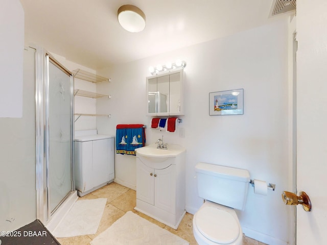 823 E 10th Ave, New Smyrna Beach, FL 32169 - bathroom featuring vanity, a shower stall, tile patterned flooring, and washing machine and dryer