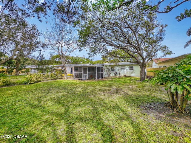 823 E 10th Ave, New Smyrna Beach, FL 32169 - view of yard with a sunroom