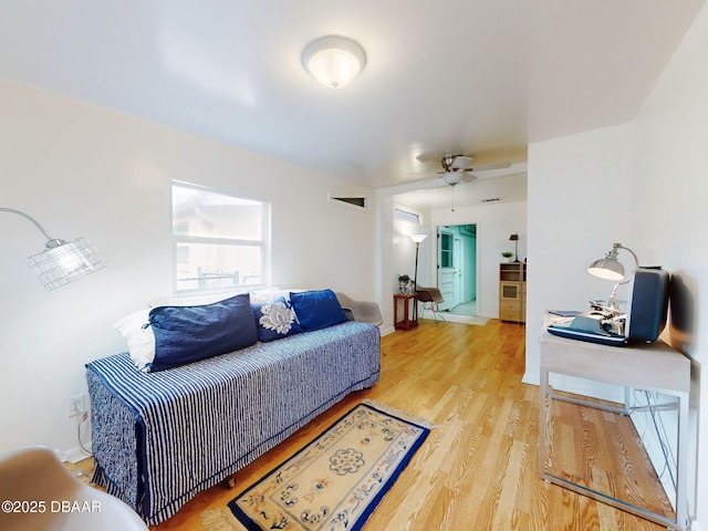 823 E 10th Ave, New Smyrna Beach, FL 32169 - living area featuring wood finished floors and a ceiling fan