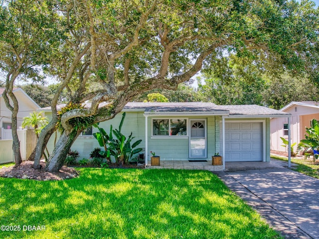 823 E 10th Ave, New Smyrna Beach, FL 32169 - view of front facade featuring an attached garage, a front lawn, and concrete driveway