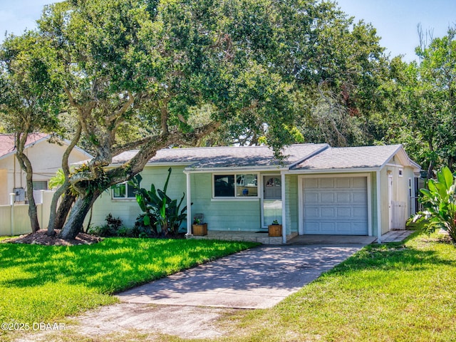 823 E 10th Ave, New Smyrna Beach, FL 32169 - ranch-style home featuring driveway, an attached garage, and a front yard