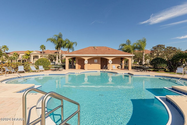 view of swimming pool with a patio