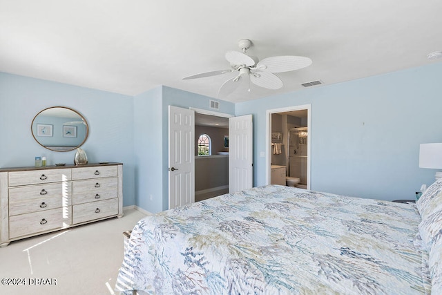 carpeted bedroom featuring ceiling fan and connected bathroom