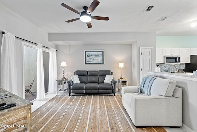 living room featuring ceiling fan