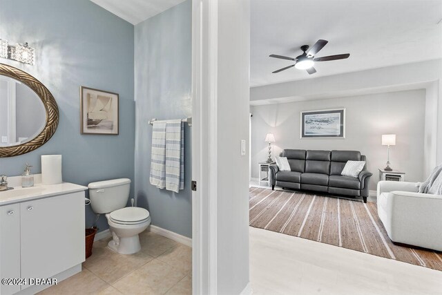 bathroom featuring vanity, tile patterned floors, toilet, and ceiling fan