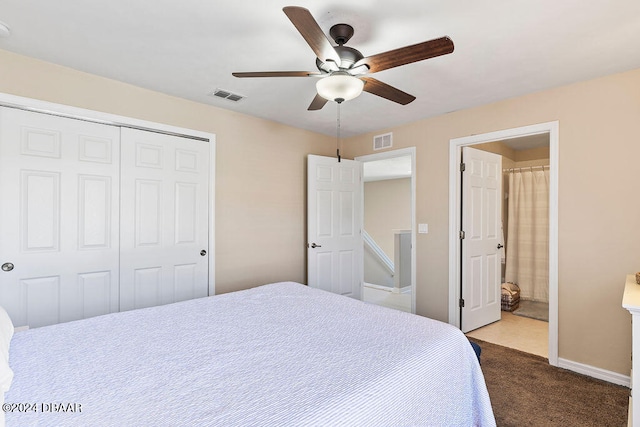 carpeted bedroom with ceiling fan, connected bathroom, and a closet