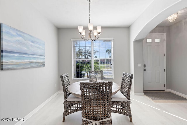 dining space with an inviting chandelier