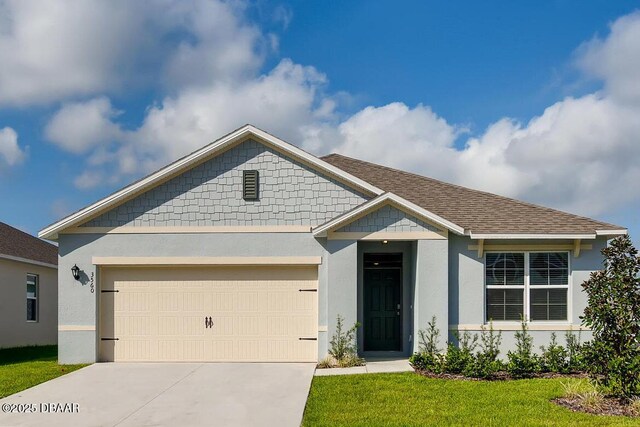 70 Melogold Dr, Ormond Beach, FL 32174 - view of front of home featuring concrete driveway, a front yard, stucco siding, and a garage