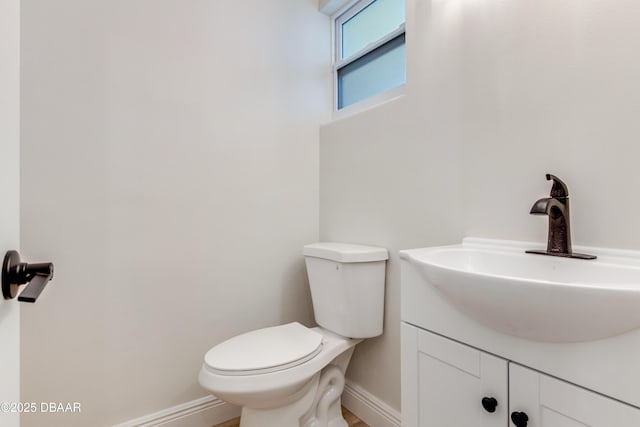 bathroom featuring toilet and vanity