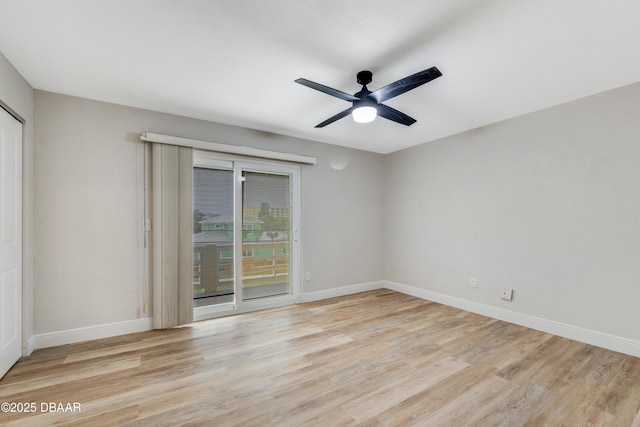 empty room featuring ceiling fan and light wood-type flooring