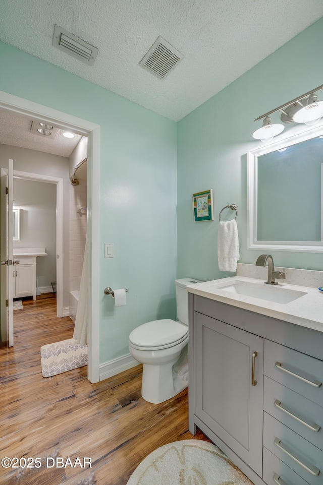 113 Club House Blvd, New Smyrna Beach, FL 32168 - full bathroom with a shower with curtain, toilet, visible vents, and wood finished floors