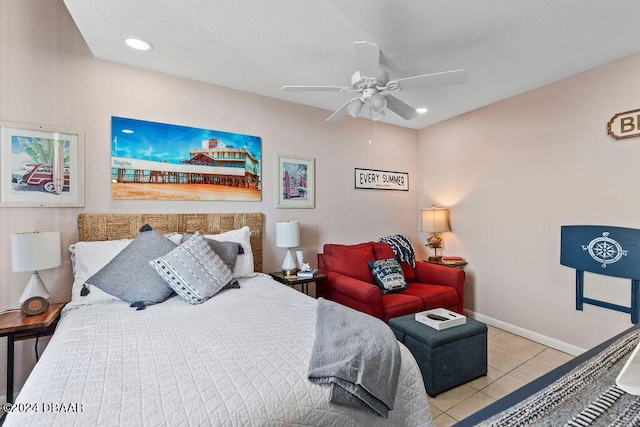 bedroom featuring light tile patterned floors, a textured ceiling, and ceiling fan