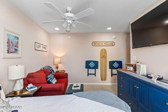 tiled bedroom with a textured ceiling and ceiling fan