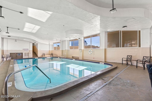 view of pool with a jacuzzi