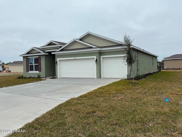 view of front of home featuring a garage and a front lawn