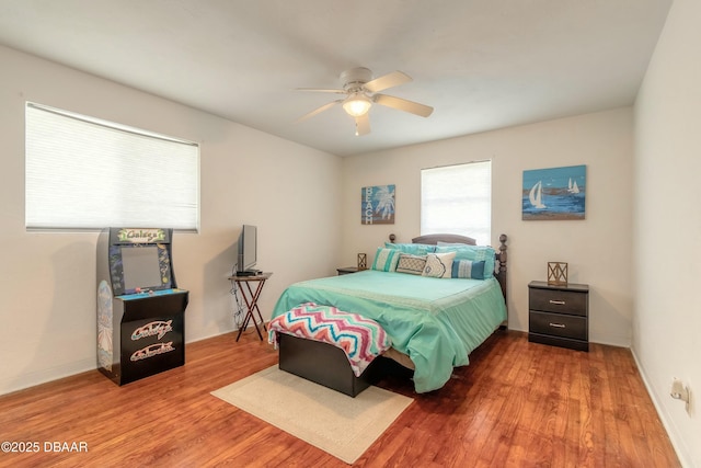 bedroom featuring ceiling fan and hardwood / wood-style floors