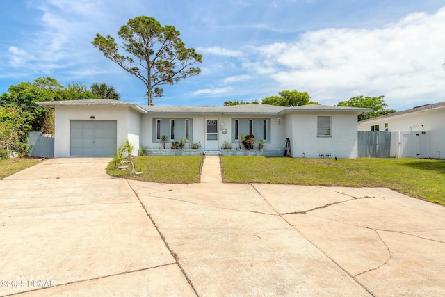 ranch-style home with a front yard and a garage