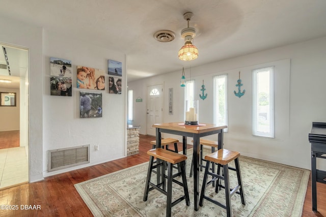 dining area featuring wood-type flooring