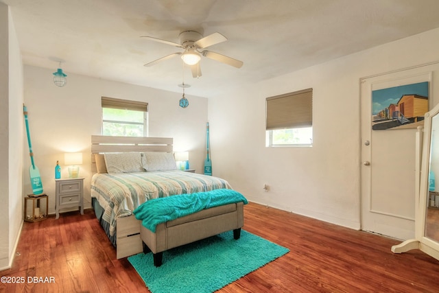 bedroom featuring ceiling fan and dark hardwood / wood-style flooring