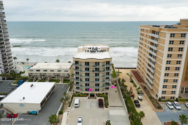 bird's eye view with a view of the beach and a water view