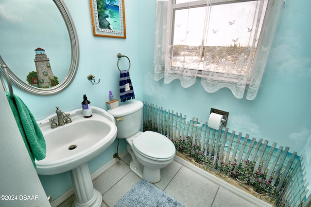 bathroom featuring tile patterned flooring and toilet