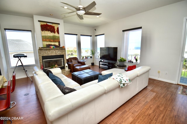 living room featuring hardwood / wood-style floors, plenty of natural light, and ceiling fan