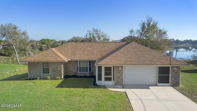 single story home with brick siding, a shingled roof, a garage, driveway, and a front lawn