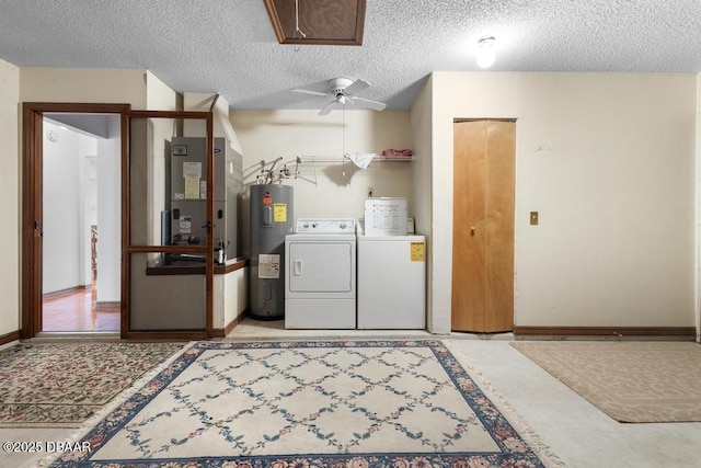 clothes washing area featuring attic access, washing machine and clothes dryer, heating unit, a textured ceiling, and water heater