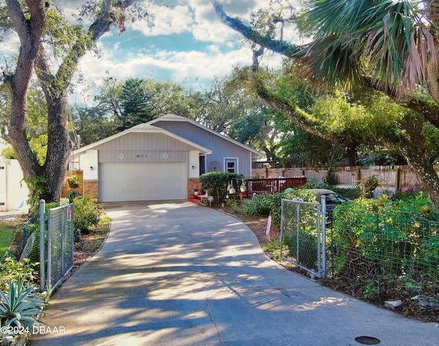 view of front of property featuring a garage and a deck