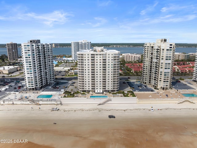 aerial view featuring a view of city and a water view