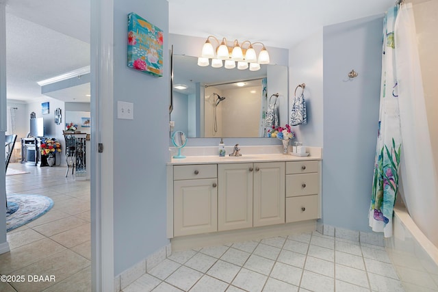 bathroom with an inviting chandelier, vanity, tile patterned floors, shower / tub combo, and baseboards