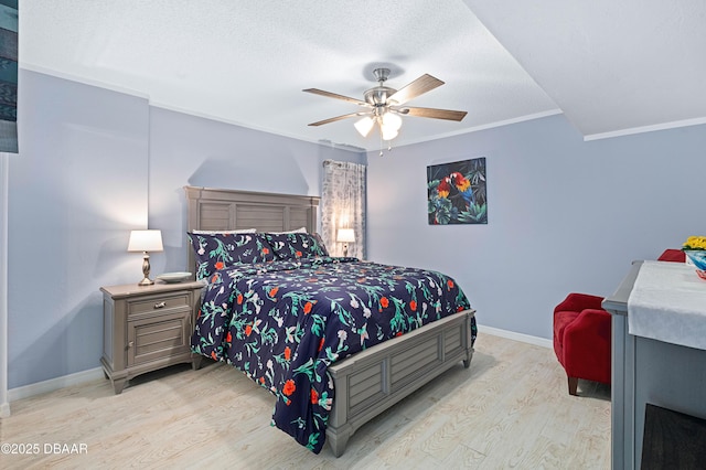 bedroom featuring a textured ceiling, baseboards, ornamental molding, wood finished floors, and a ceiling fan