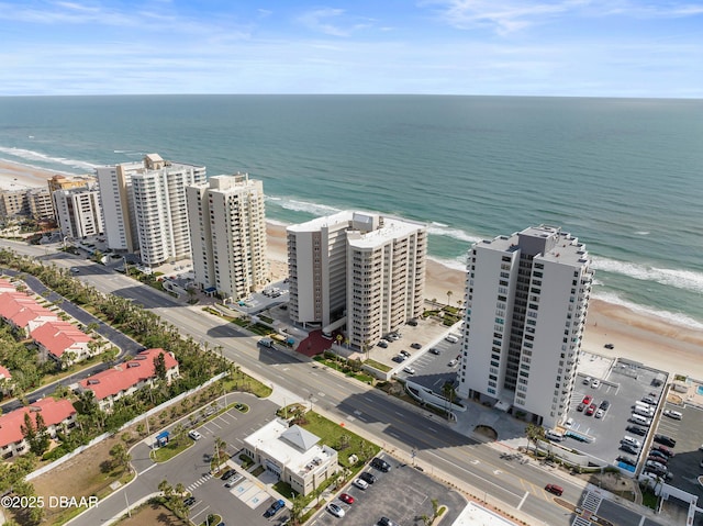 drone / aerial view featuring a view of the beach and a water view