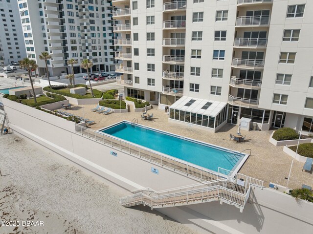 community pool featuring a patio area