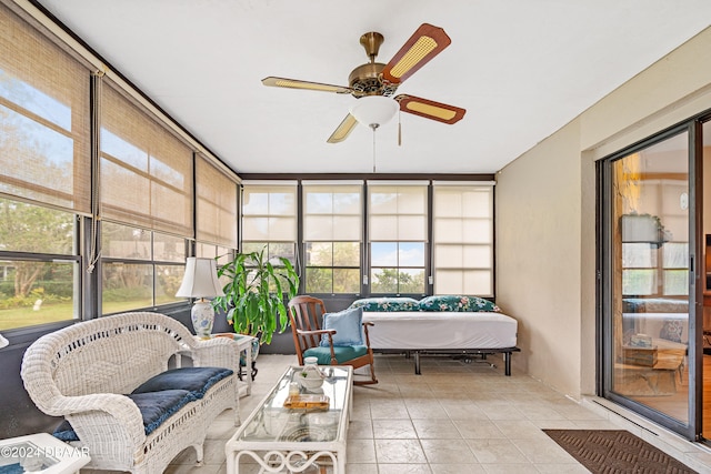 sunroom / solarium with ceiling fan and a healthy amount of sunlight