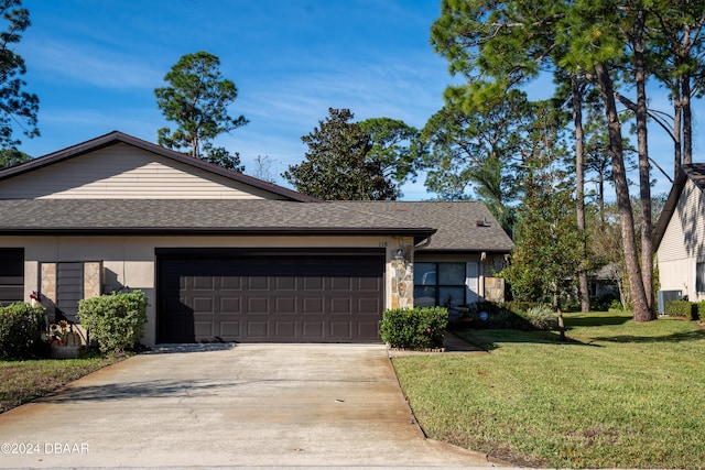 view of front facade featuring central AC, a garage, and a front lawn