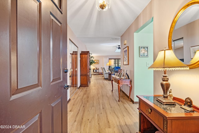 interior space with ceiling fan and light hardwood / wood-style floors