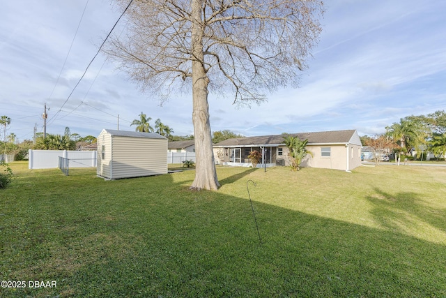 view of yard featuring a storage unit