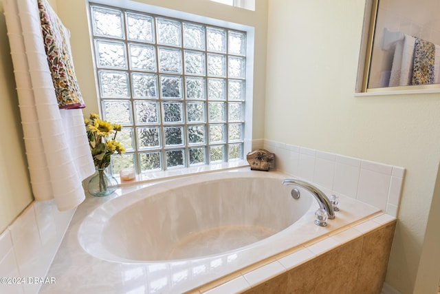 bathroom with tiled tub