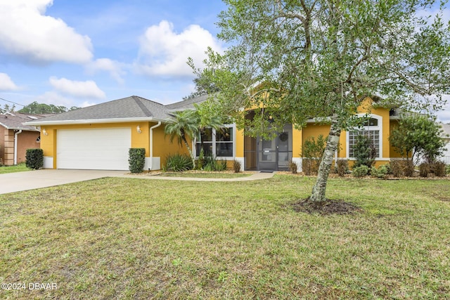 view of front of house featuring a garage and a front yard