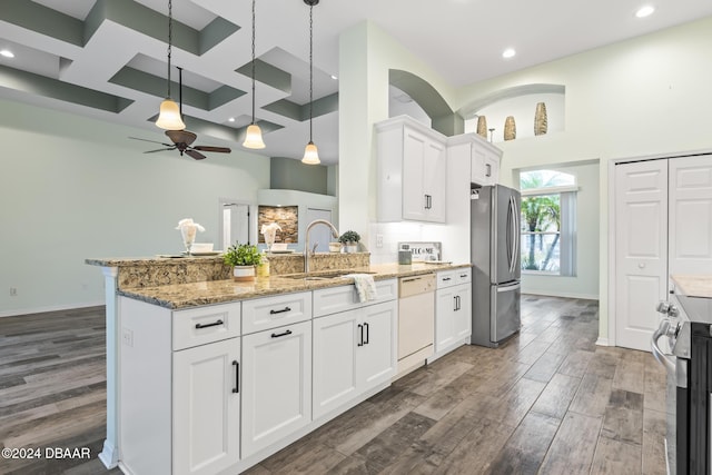 kitchen with white cabinets, appliances with stainless steel finishes, ceiling fan, and a high ceiling