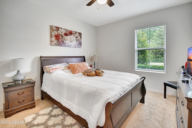 316 Nowell Loop, Deland, FL 32724 - bedroom with light carpet, baseboards, and ceiling fan