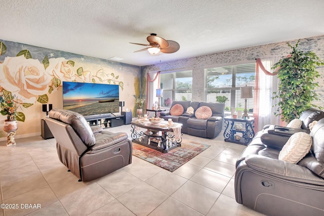 316 Nowell Loop, Deland, FL 32724 - living room with ceiling fan, a textured ceiling, wallpapered walls, and light tile patterned floors